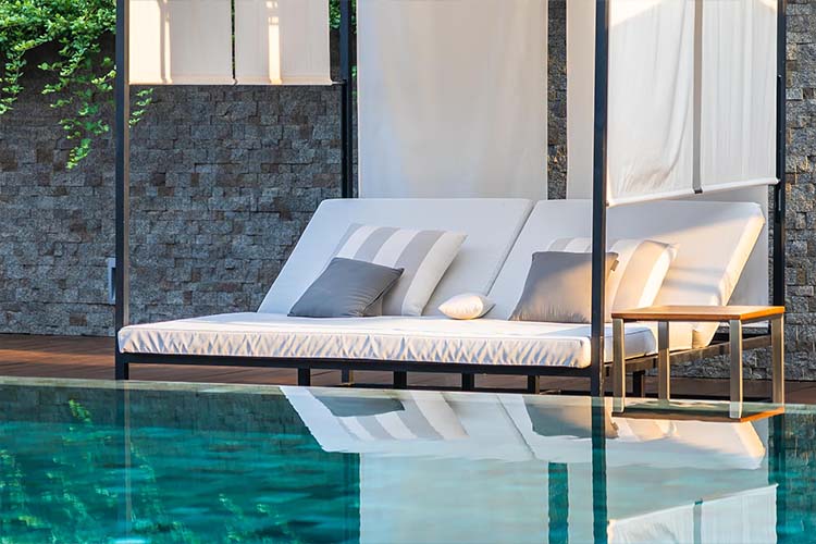 Enhancing pool beauty through lighting, finishes, landscaping, and artistic detailing.