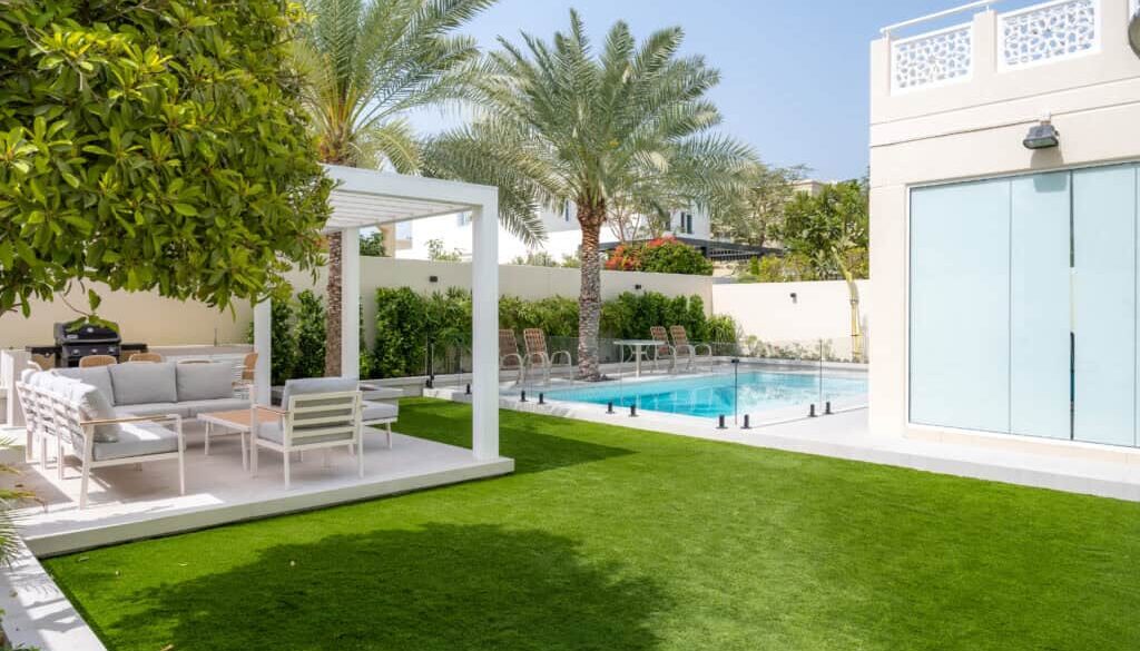 Landscaped garden area with greenery and finished residential outdoor features