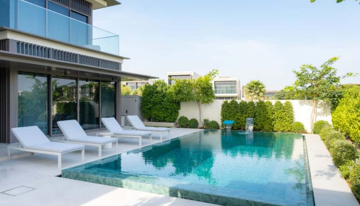 Landscaped villa exterior with garden greenery and finished outdoor design